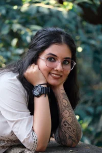 Modelling image of Reshma Das in ethnic attire, nature in the background, face of a smiling lady